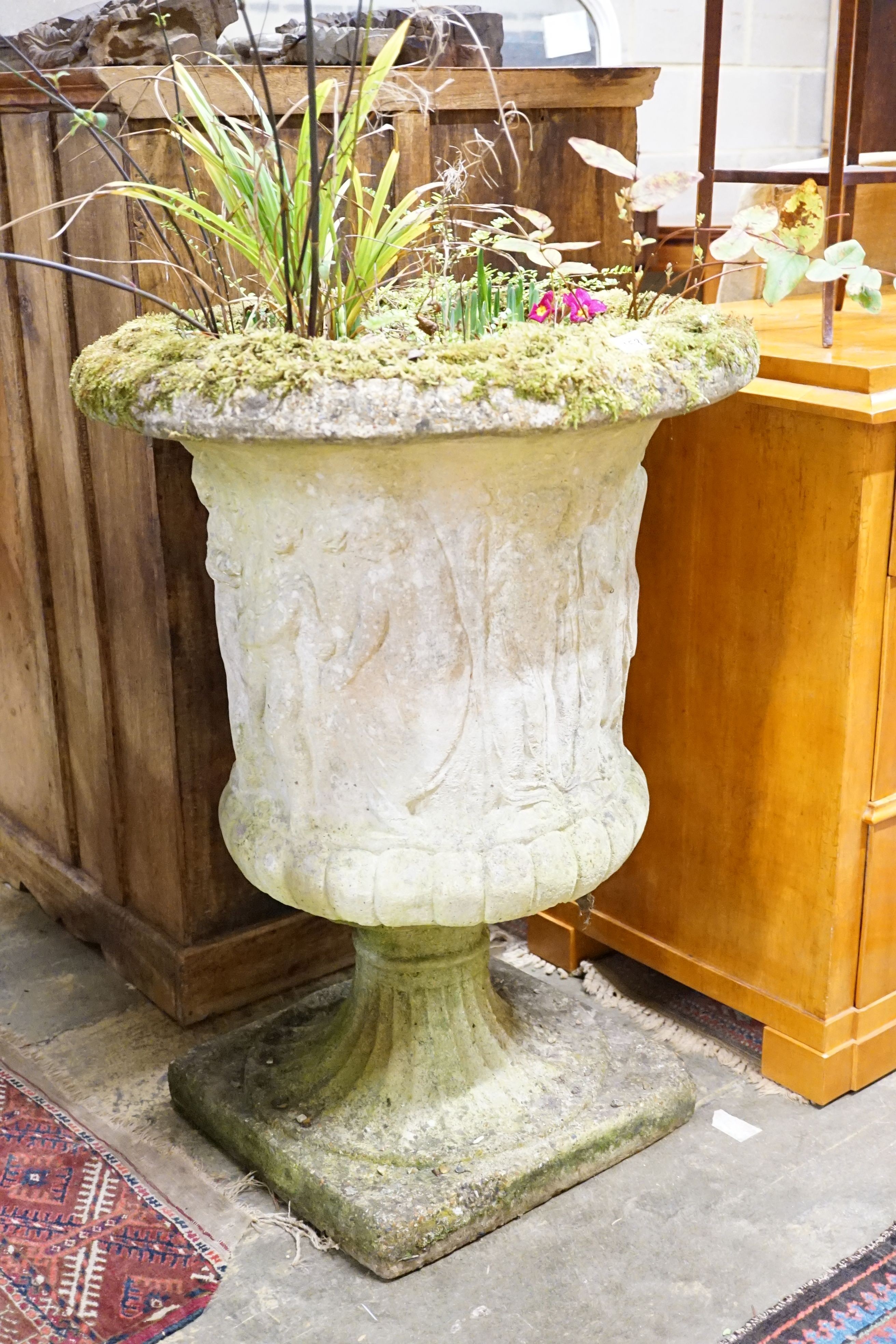 A reconstituted stone campana garden urn decorated with classical figures, height 86cm, diameter 62cm
